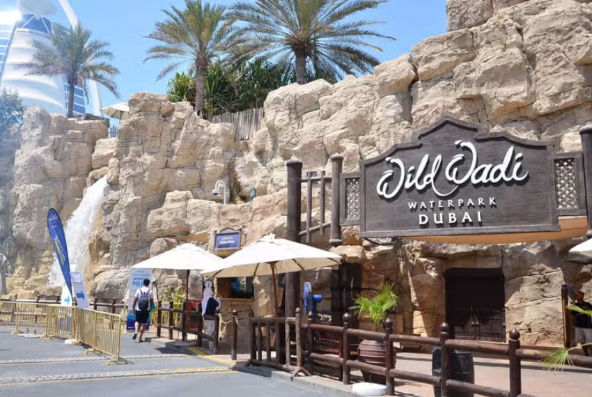 Visitors enjoying the thrilling water slides at Wild Wadi Adventure in Dubai.