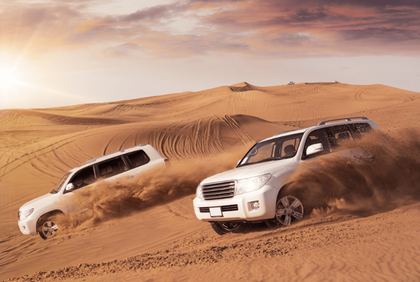 Red Dune Desert Safari, with a 4x4 vehicle racing over the dunes.