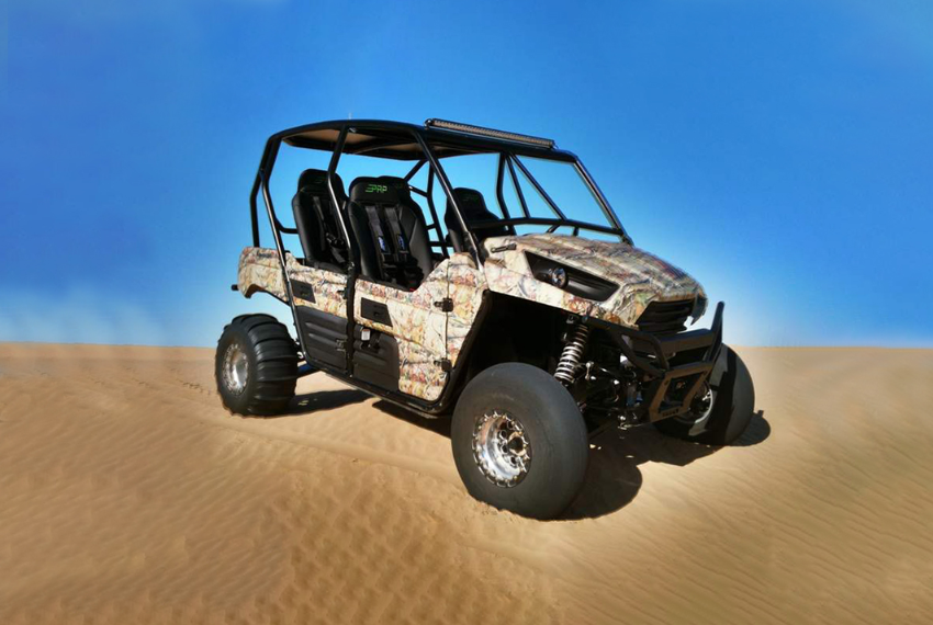 Kawasaki Teryx 4 Buggy navigating desert dunes.