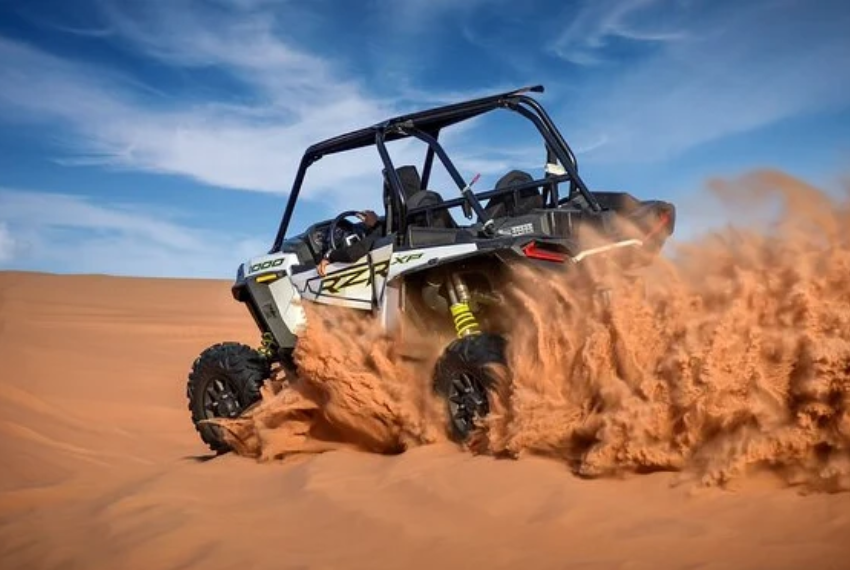 Polarize Dune Buggy driving through rocky paths.